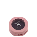 Sombra preta em embalagem compacta circular.