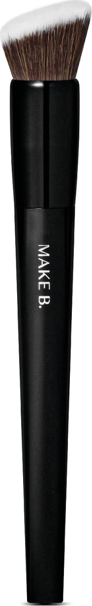 É um pincel de maquiagem de formato cilíndrico e alongado. O cabo é preto e possui o texto "MAKE B." impresso. As cerdas são macias e de cor castanha escura.  O design é simples e minimalista, com o foco no desempenho e funcionalidade do produto.