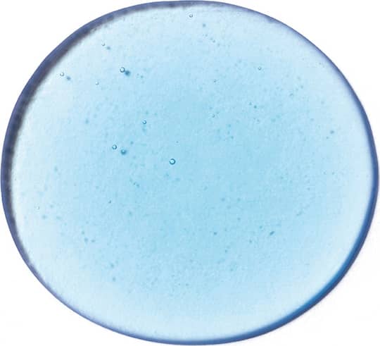 Imagem da textura azul clara, brilhante e com pequenas bolhas, em superfície lisa e transparente, mostrando a tonalidade do shampoo Next.