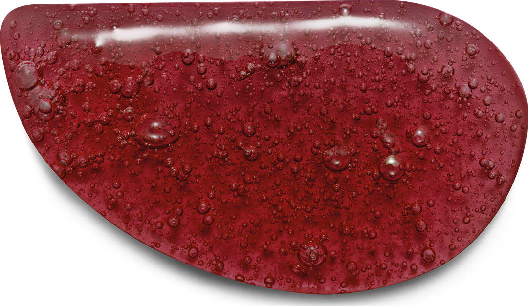 Textura vermelha brilhante e úmida com gotas de água do sabonete líquido Nativa SPA Cereja Rouge com superfície irregular e texturizada.
