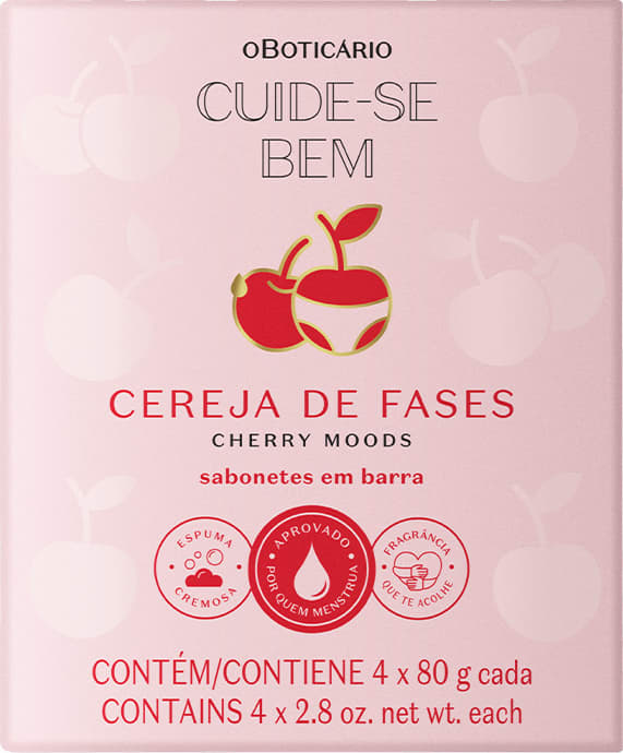 Imagem de caixa de papelão rosa com imagem de cerejas vermelhas e texto "Cuide-se Bem Cereja de Fases". Contém quatro barras de sabonete de cereja, com informações sobre espuma, aprovação e fragrância.