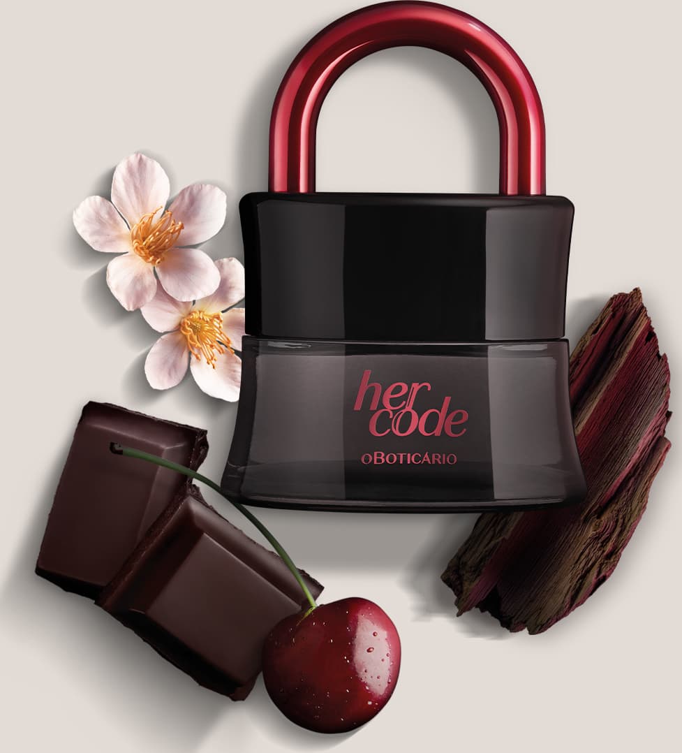 Imagem de um vidro preto com arco rosa metalizado de Eau de Parfum Her Code Clímax, sobre superfície clara com flores, chocolate e madeira ao redor.