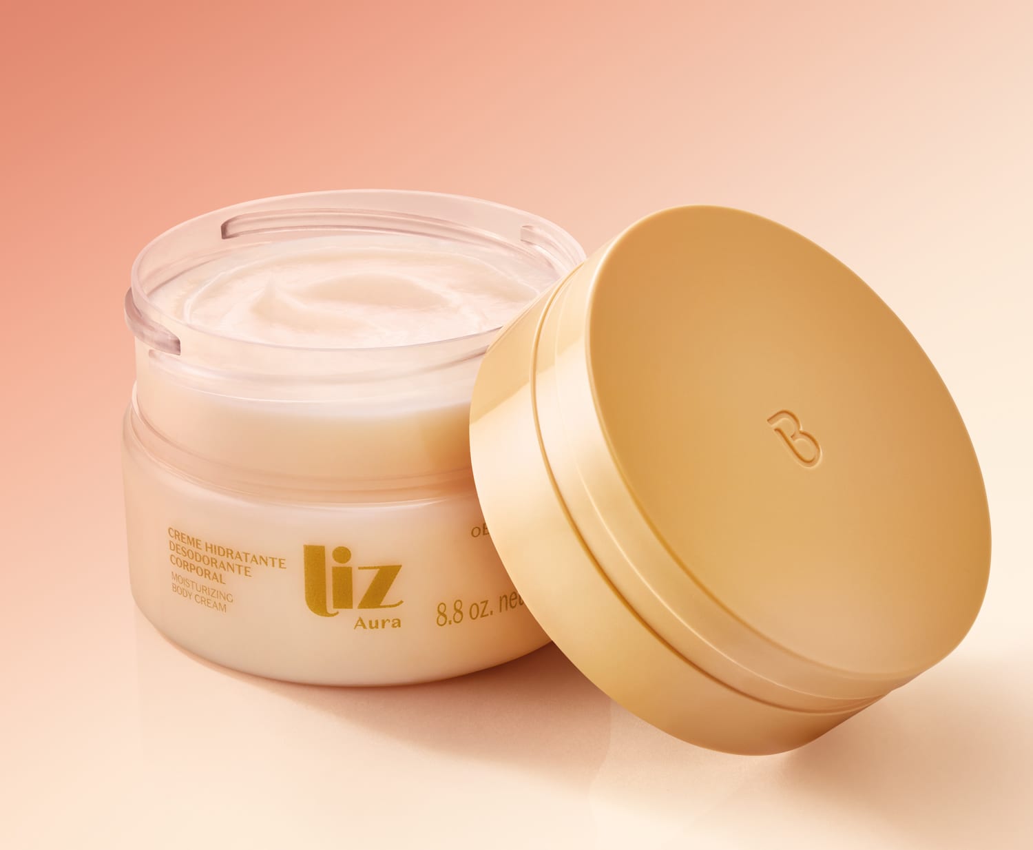 Pote de creme hidratante da marca Liz em fundo laranja claro, com tampa dourada encostada ao lado e textura cremosa e branca.