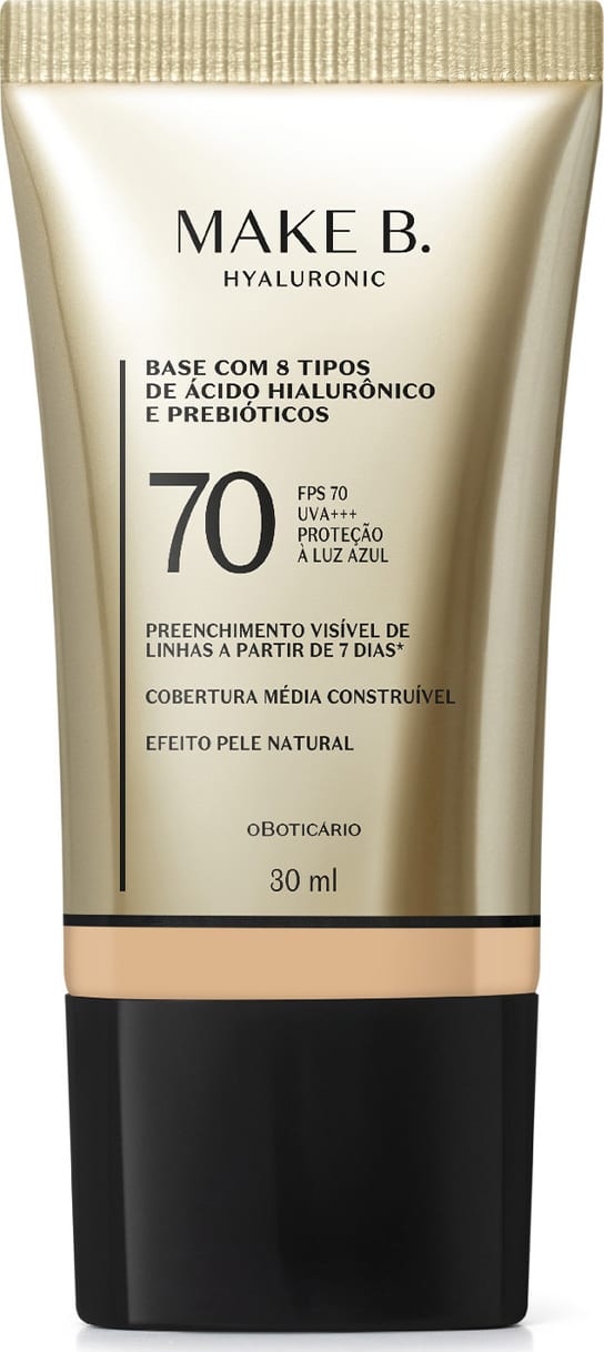 Frasco de base com 8 tipos de ácido hialurônico e probióticos da marca Make B., com FPS 70, UVA+++ e proteção à luz azul. Embalagem em tons de bege e preto, com informações sobre o produto.