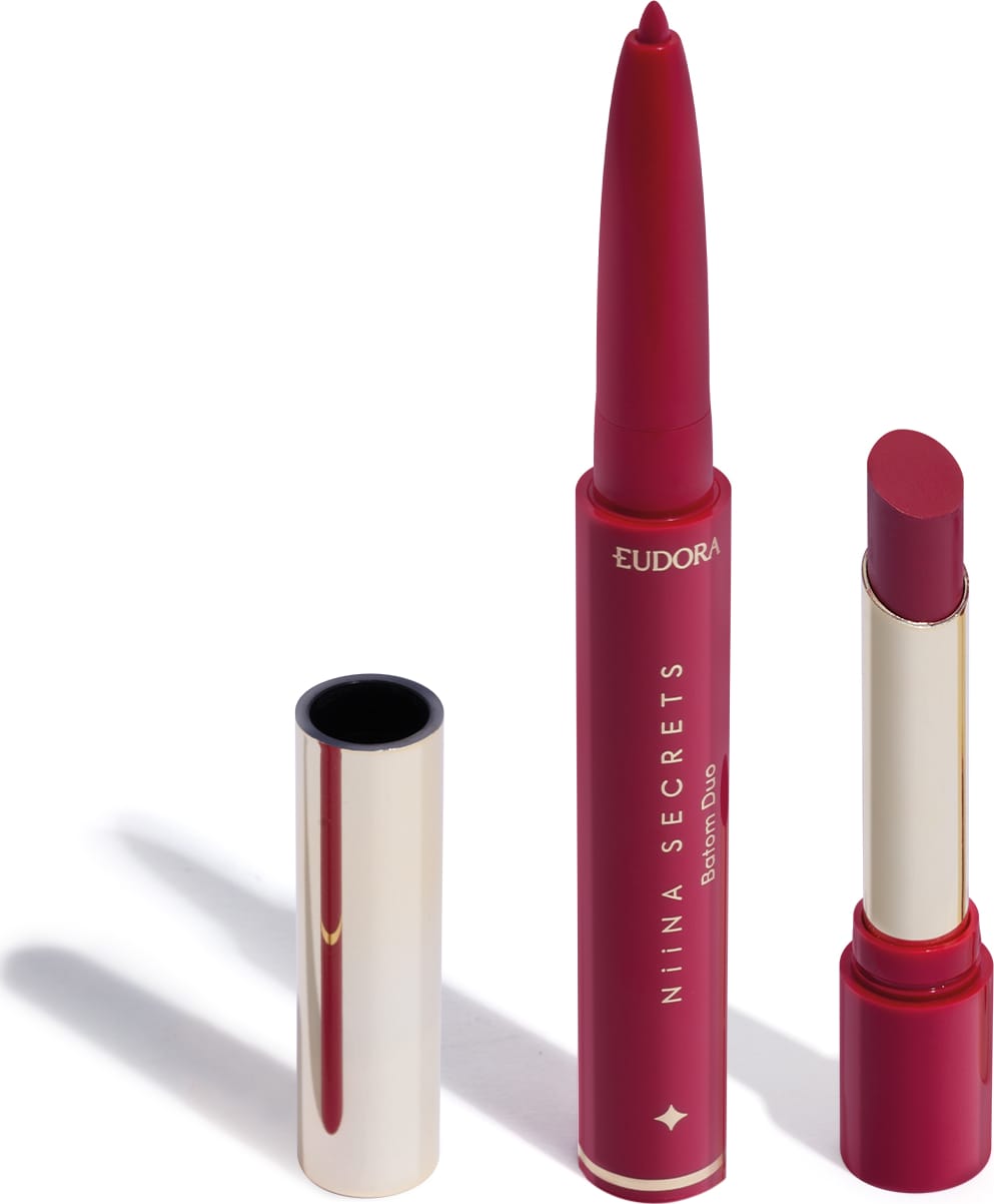 O produto apresentado na imagem é um batom da marca Niina Secrets Eudora, de cor rosa vibrante. São dois produtos em um: uma lapiseira delineadora com a ponta afiada e o batom em formato stick, com embalagem também rosa e detalhes dourados.
