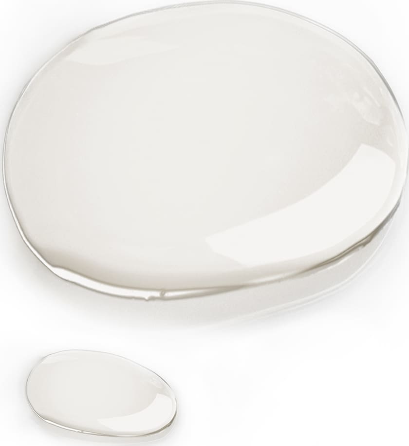 Textura do produto, em uma forma arredondada e transparente. Com uma consistência líquida.