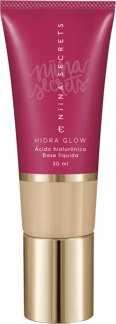 Tubo de base líquida Hidra Glow da marca Niina Secrets, com embalagem rosa e detalhes dourados, contendo 30 ml do produto.