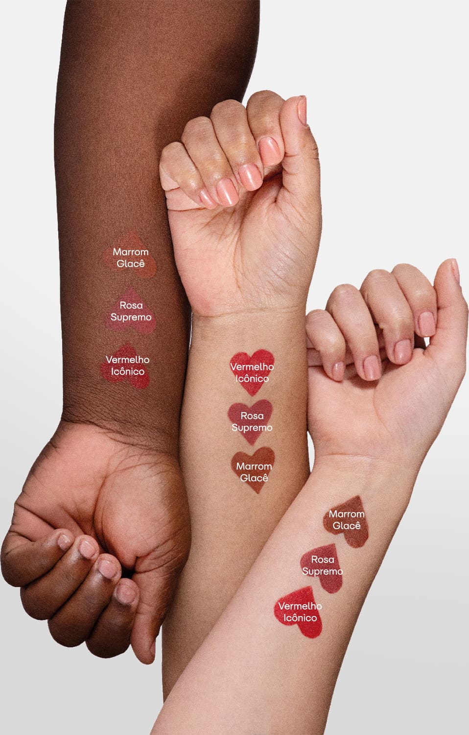 Imagem de três braços femininos com diferentes tonalidades de pele. Em cada um deles, amostras das cores do batom semi matte POP Quem Disse, Berenice?, mostrando como cada uma delas se apresenta.