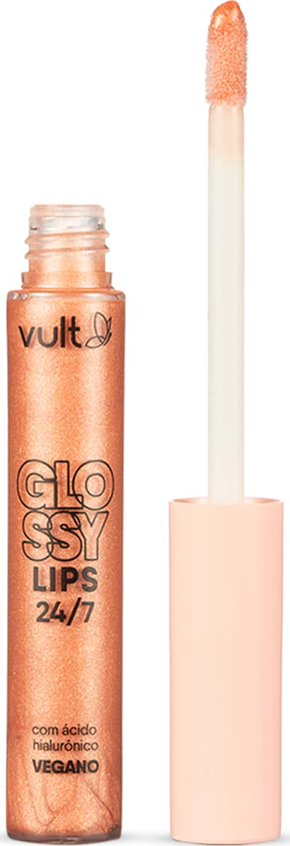 Gloss labial em embalagem cilíndrica transparente contendo o gloss brilhante com tonalidade laranja claríssimo. Produto aberto com tampa salmão claro ao lado da embalagem. Rótulo em letras pretas no centro. Aplicador do tipo pincel firme.