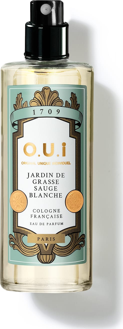 Frasco de eau de parfum da marca O.U.i. com rótulo em tons de verde e dourado, apresentando o nome "Jardin de Grasse Sauge Blanche" e informações sobre a origem francesa do produto.