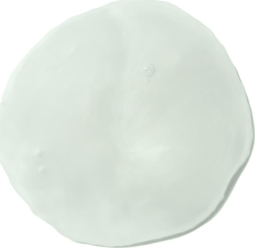 Textura do creme, suave e cremosa, com aparência translúcida e brilhante. Cor predominante é um tom de verde-claro, com aspecto gelatinoso e uniforme.