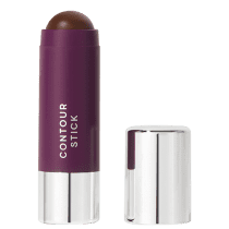 A imagem mostra o produto Contour Stick da marca Océane. Um bastão de maquiagem em formato cilíndrico com embalagem roxa e tampa prateada ao lado. O nome do produto "CONTOUR STICK" está impresso em letras brancas sobre a cor roxa.