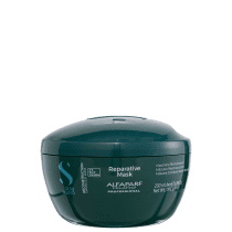 Máscara em embalagem plástica verde escura arredondada, com tampa de rosquear. A embalagem tem um design moderno e elegante, com letras dos textos em branco.