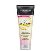 Embalagem plástica nas cores preta, amarela e rosa. Descrição indica que é um condicionador clareador e nutritivo para cabelos loiros naturais e brilhantes. Apresenta imagens de fatias de limão e gotas.