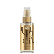 Frasco de óleo da linha Oil Reflections da Wella Professionals, com embalagem dourada e transparente, contendo 100 ml do produto.