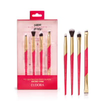 Kit de pincéis para olhos da linha Secret Pink da Eudora, contendo 6 pincéis de diferentes formatos em tons de rosa e dourado, acondicionados em uma embalagem vermelha com detalhes em rosa.