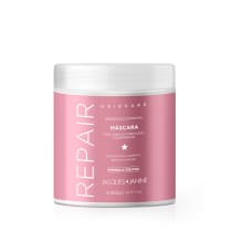 Máscara capilar da linha Haircare da Jacques Janine Professionnel, em embalagem plástica branca e rosa, com rótulo indicando "Reparação Intensa" e "Fórmula Vegana".
