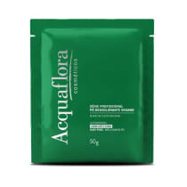 Pacote verde da série profissional Acquaflora, contendo 50g de pó descolorante vegano, com blend de óleos naturais, ultrarápido e livre de poeira.