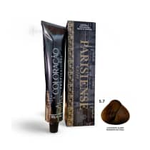 A imagem mostra produtos de coloração de cabelo profissional da marca Paris Cosmetics. Há uma caixa retangular exibindo o logotipo e nome "Paris Cosmetics". Ao lado está um tubo preto brilhante com a mesma marca impressa, contendo o creme colorante.