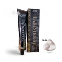 A imagem mostra produtos de coloração de cabelo profissional da marca Paris Cosmetics. Há uma caixa retangular exibindo o logotipo e nome "Paris Cosmetics". Ao lado está um tubo preto brilhante com a mesma marca impressa, contendo o creme colorante.