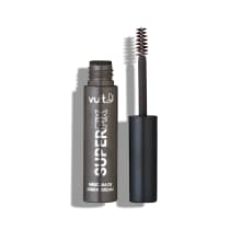 O produto apresentado na imagem é uma máscara de sobrancelhas da marca Vult. A embalagem é um tubo plástico de cor cinza, com o nome impresso em branco. O aplicador da máscara é visível na parte superior do tubo, com uma escova de cerdas escuras.