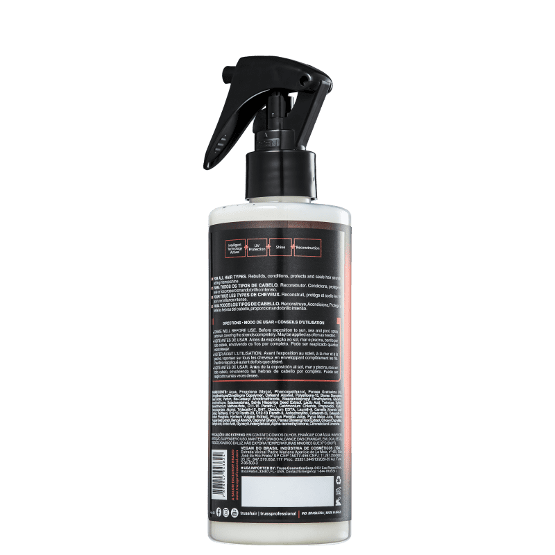 Produto para cuidados capilares da marca TRUSS Professional. Rótulo preto com texto informativo em várias línguas, incluindo ingredientes, instruções de uso e avisos. Formato cilíndrico com capacidade de 260ml.