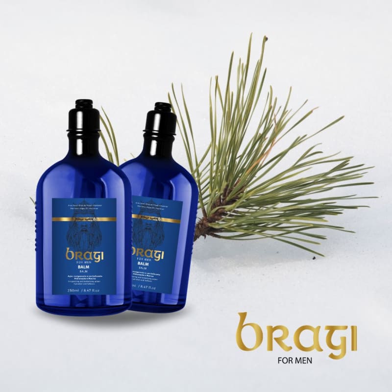 A imagem mostra dois grandes frascos azuis escuros de plástico em destaque. Ao lado dos frascos, há um ramo de uma planta com folhas compridas e finas, provavelmente representando um dos ingredientes naturais utilizados nos produtos.