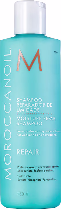 A imagem mostra a embalagem do Shampoo Moroccanoil Repair Moisture 250ml. O frasco é de plástico na cor azul claro, com o nome da marca e as informações do produto escritas em letras brancas e laranja. O rótulo informa que o shampoo é reparador de umidade