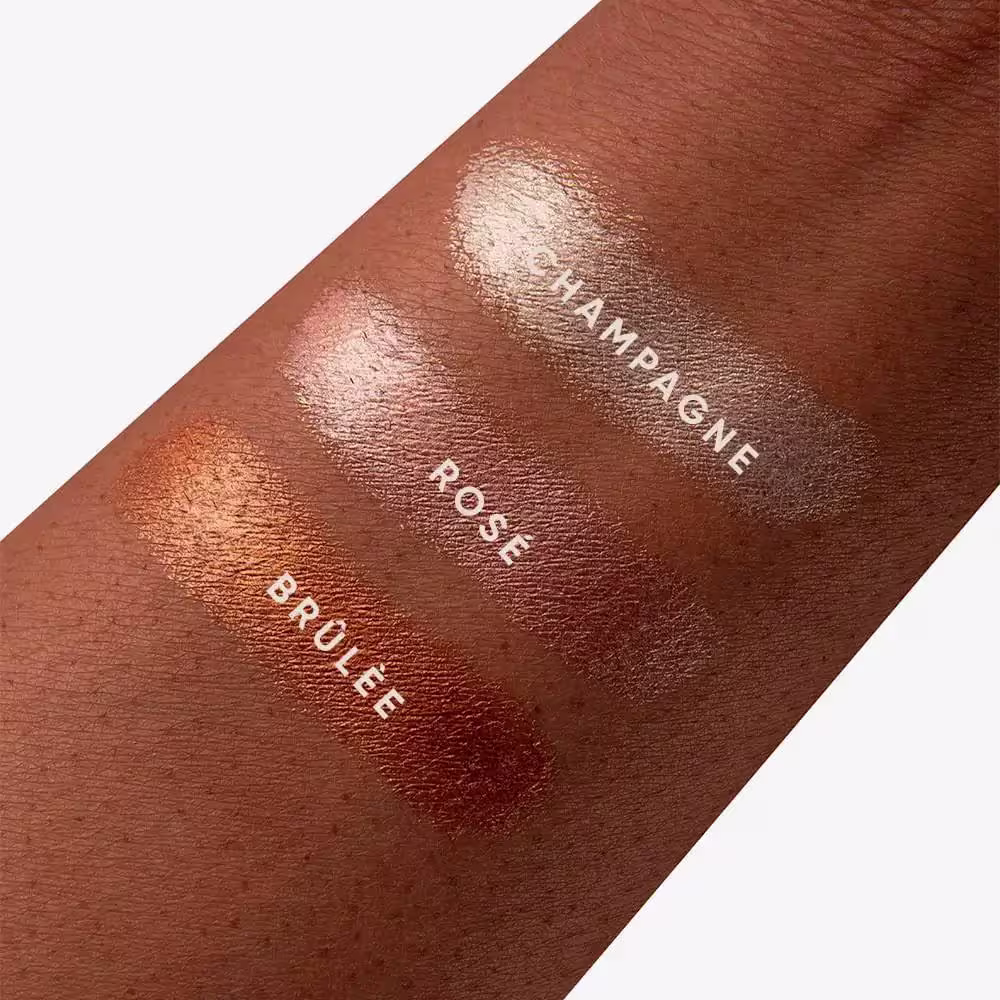 A imagem apresenta amostra das cores Brûlée, "Champagne" e "Rose" em pele negra