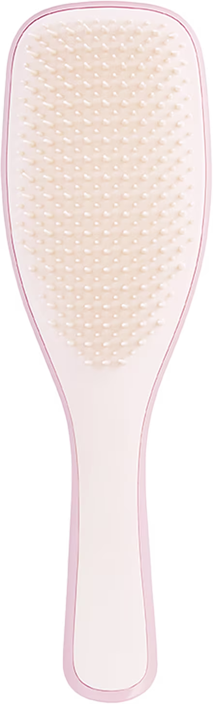Escova de cabelo Tangle Teezer em formato alongado. Cabo plástico rosa claro. Superfície de escovação oval, texturizada com pequenos nódulos plásticos arredondados na cor bege claro. Design ergonômico para facilitar o penteado e desembaraçar os cabelos.