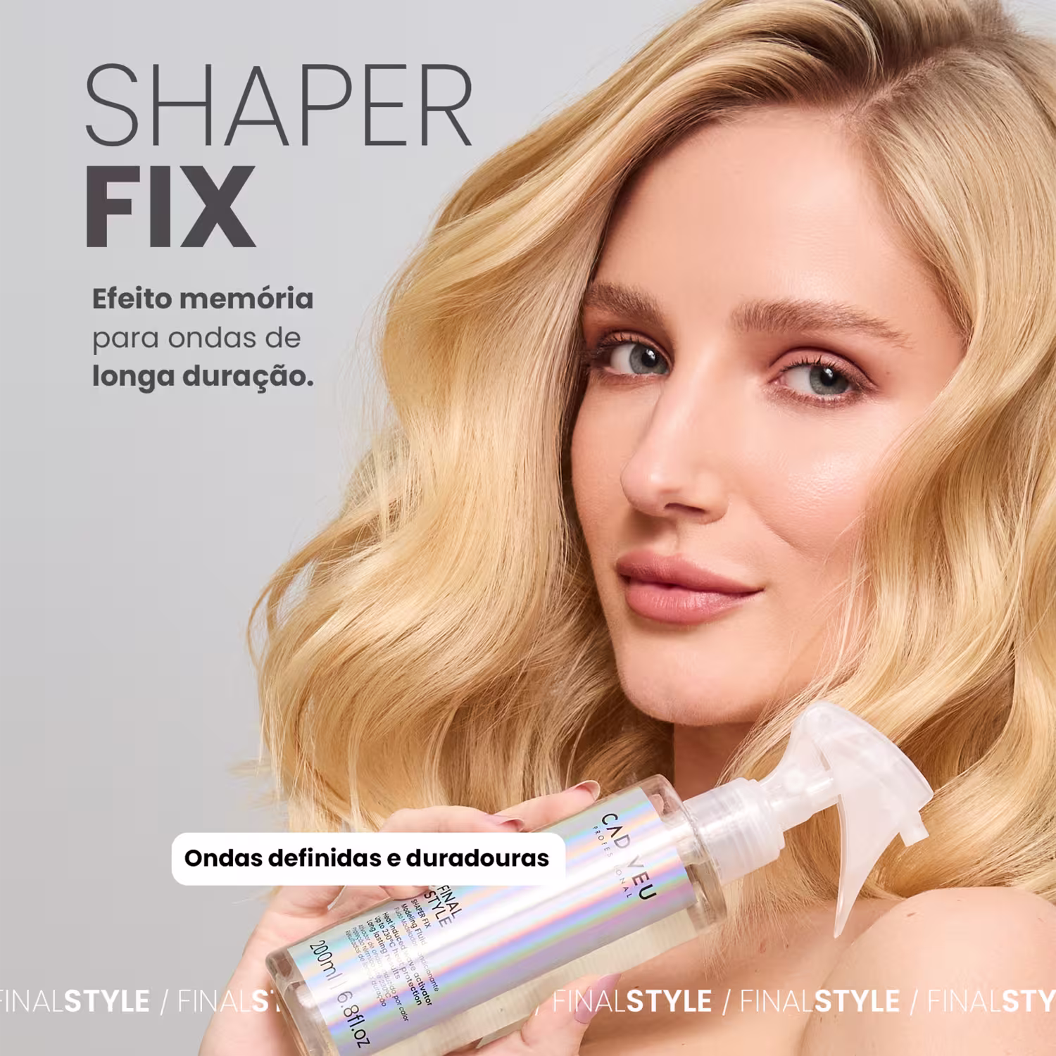 A imagem mostra uma modelo loira com cabelos levemente ondulados segurando o produto Shaper Fix. Traz ainda o texto "efeito memória para ondas de longa duração" e "ondas definidas e duradouras".
