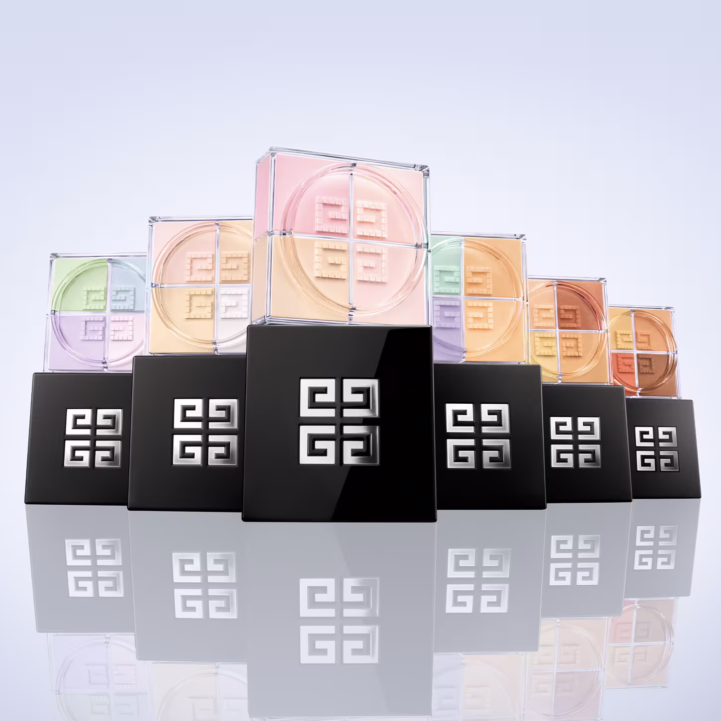 A imagem mostra todos os pós soltos e suas tonalidades, permitindo ver a sua variada gama de cores. na parte inferior da foto há o reflexo deles.