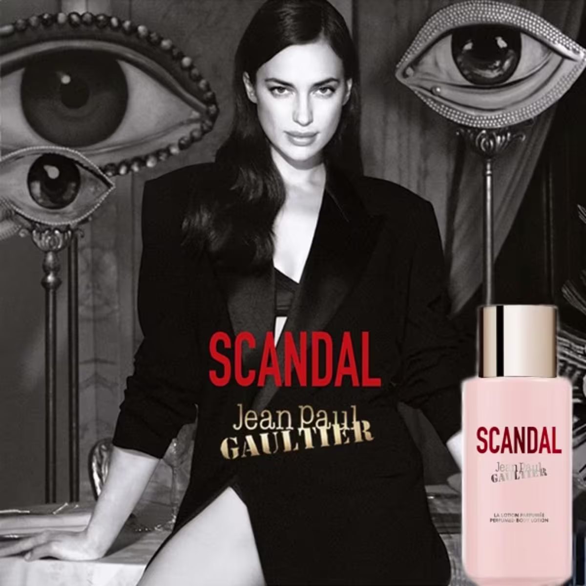 Creme Corporal Scandal da marca Jean Paul Gaultier. Frasco na cor rosa claro. Rótulo vermelho com o nome "Scandal" em letras maiúsculas brancas. Embalagem retangular simples, exibindo apenas o nome do produto e da marca.