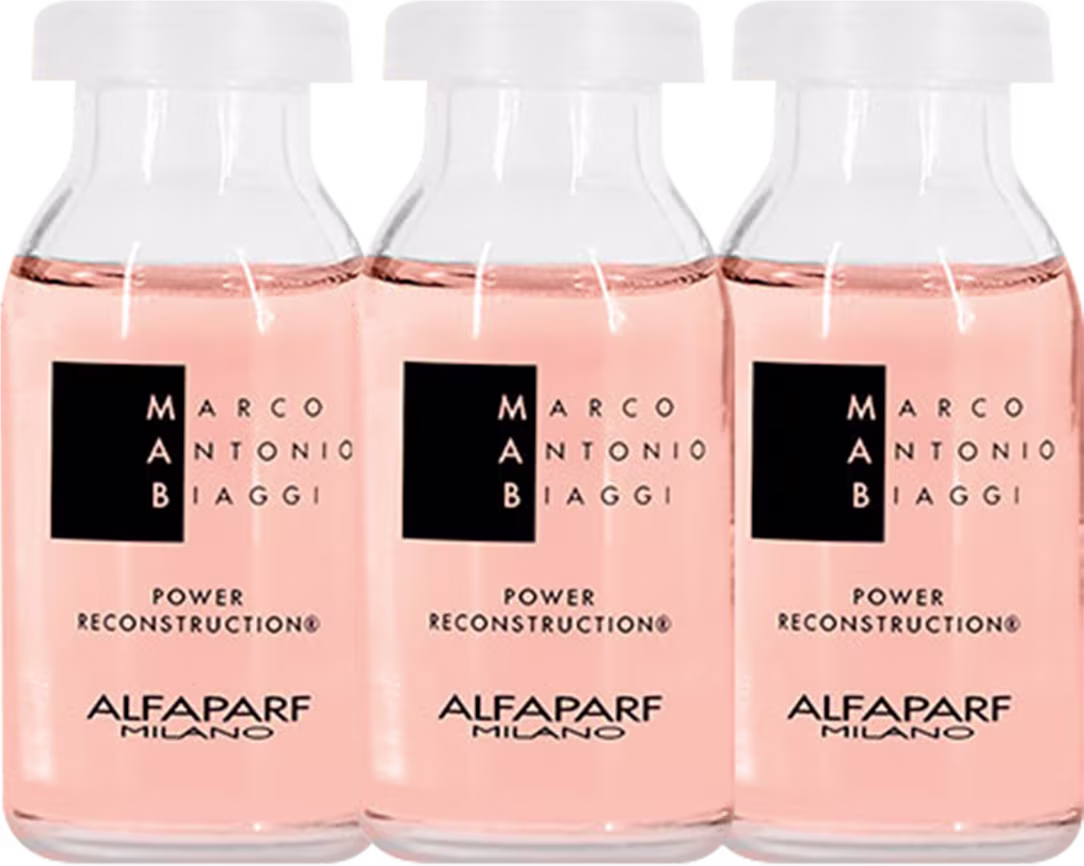 Três frascos de ampolas com líquido rosa claro dentro. Os frascos têm tampas brancas e rótulos pretos com o texto "POWER RECONSTRUCTION" em letras maiúsculas brancas.