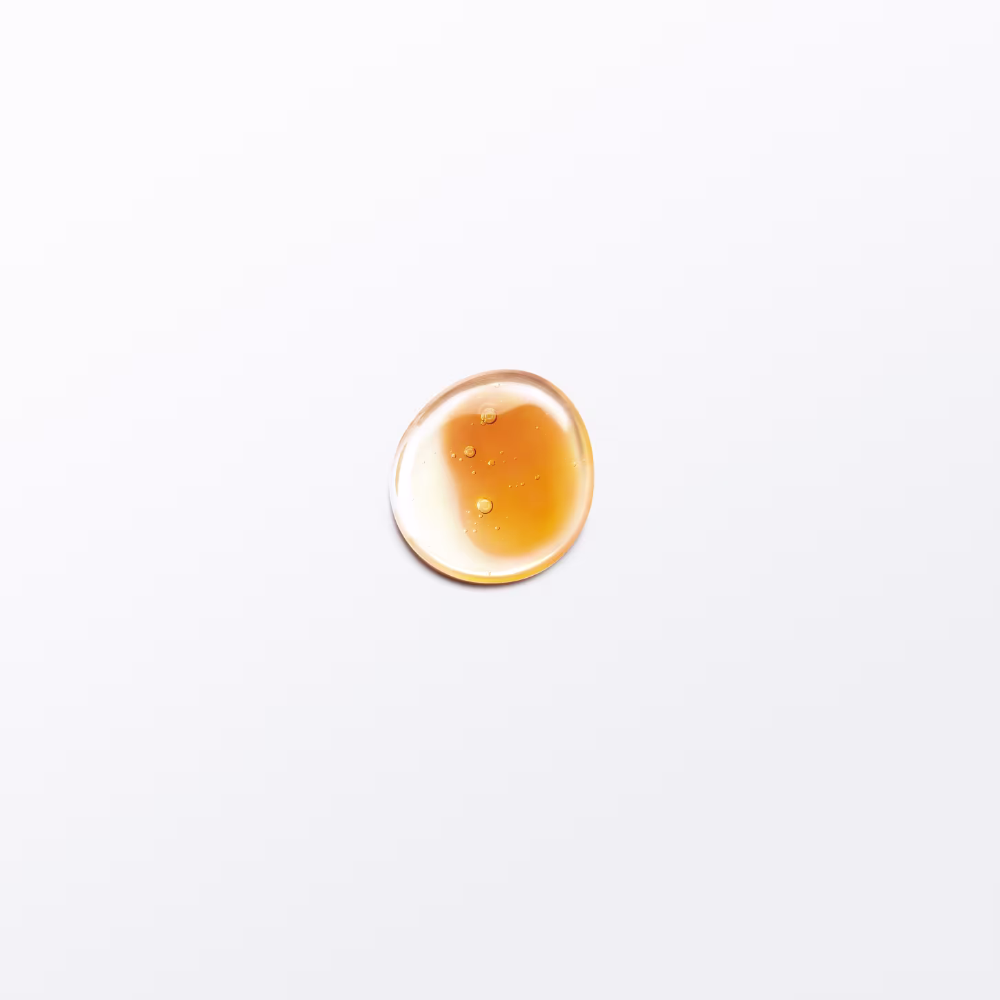 A imagem mostra uma gota do produto em fundo branco.