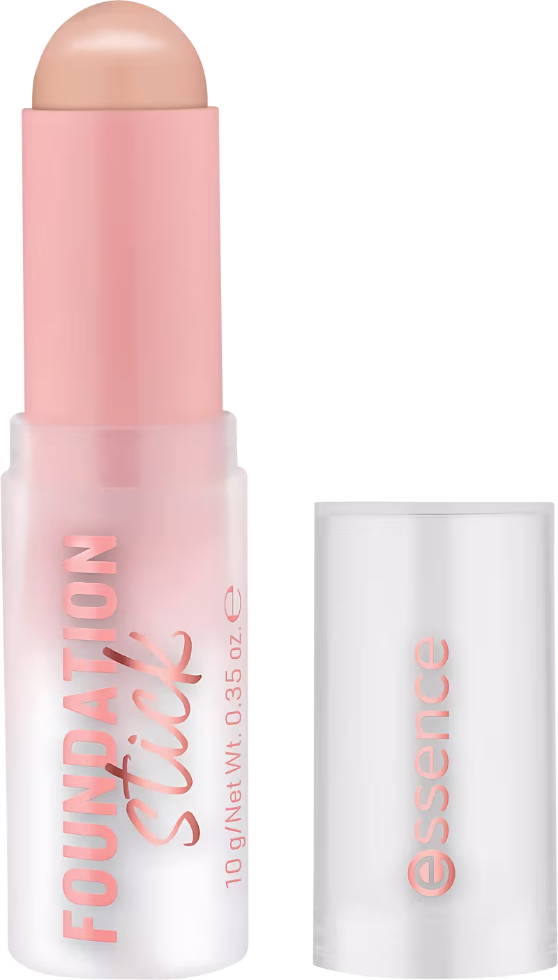 Produto de maquiagem Essence em embalagem rosa e branca, com texto "Foundation Stick" e "Essence" visível. Formato de bastão com ponta arredondada, indicando ser um produto de base ou corretivo.