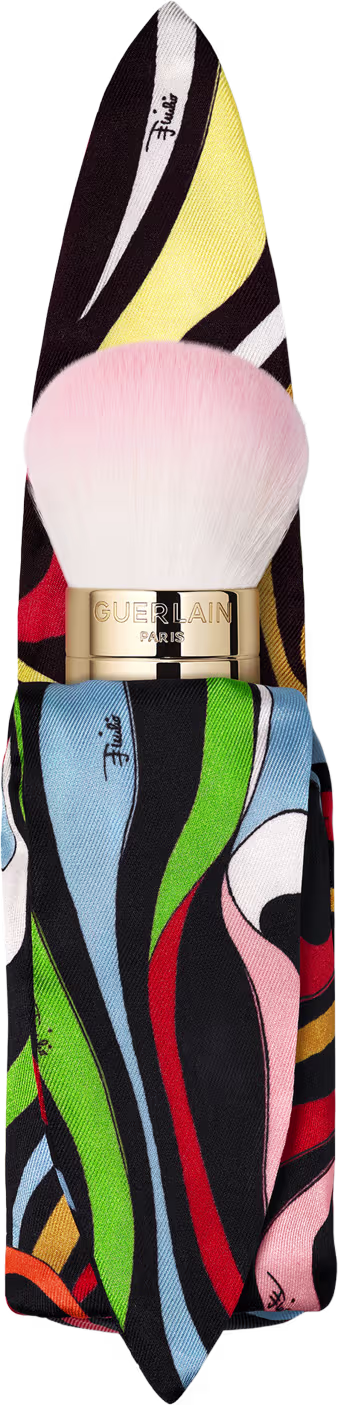 Pincel de maquiagem Guerlain com case de estampa geométrica colorida.