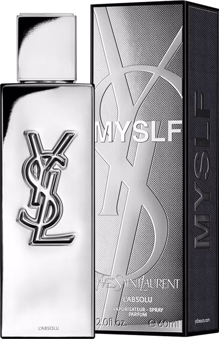 Frasco de perfume de design minimalista prateado, com o logotipo da marca Yves Saint Laurent em destaque. A embalagem possui uma forma geométrica simples e elegante, com uma tampa destacada no topo.