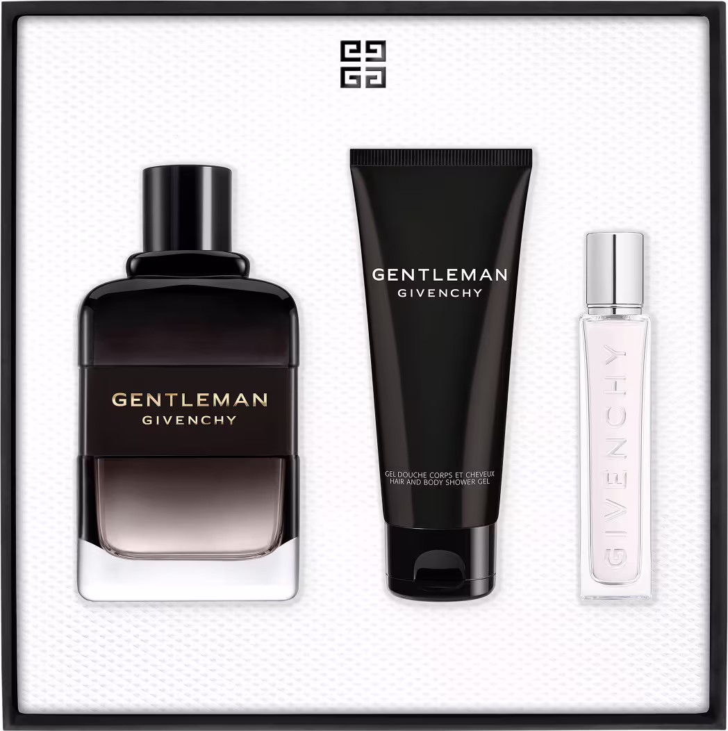 Conjunto de produtos de beleza da marca Givenchy, incluindo um frasco de perfume Gentleman Givenchy, um tubo de gel corporal e um pequeno frasco de amostra, todos em embalagens pretas e brancas com o logotipo da marca.