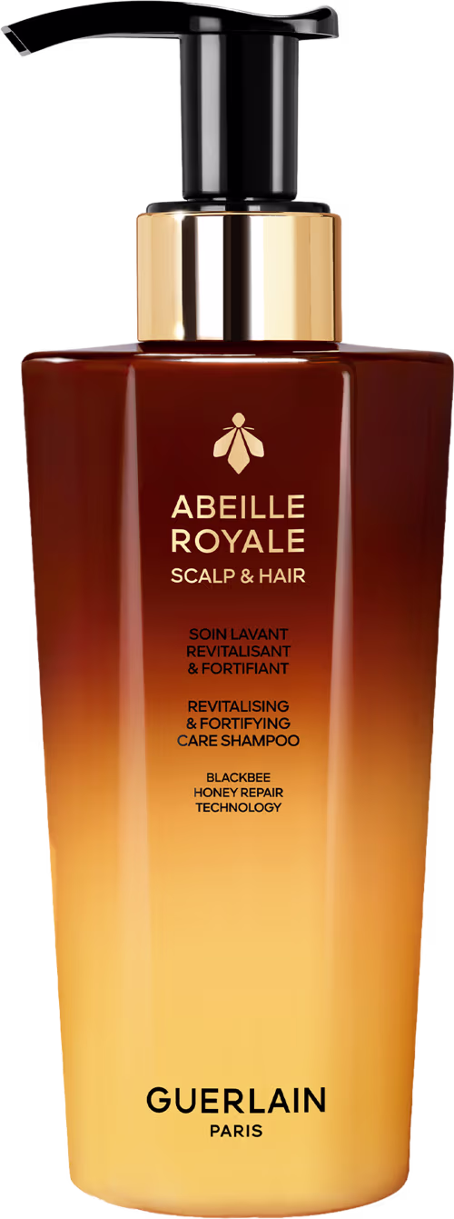 Frasco de shampoo Abeille Royale da Guerlain, com design elegante em tons de marrom e dourado, contendo tecnologia de reparo de mel de abelha para revitalizar e fortalecer o couro cabeludo e os cabelos.
