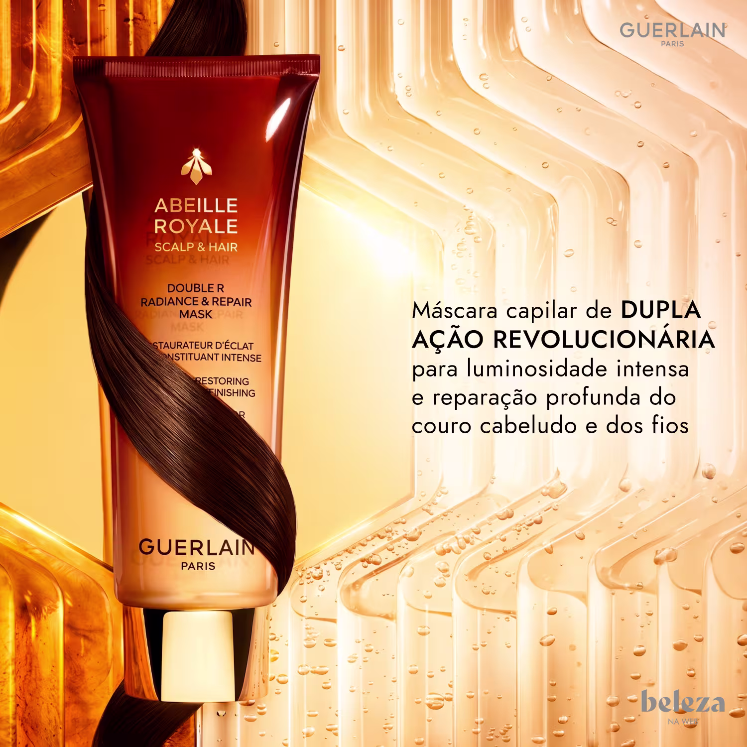 Embalagem de máscara capilar da marca Guerlain, com texto em português "Máscara capilar de DUPLA AÇÃO REVOLUCIONÁRIA para luminosidade intensa e reparação profunda do couro cabeludo e dos fios".