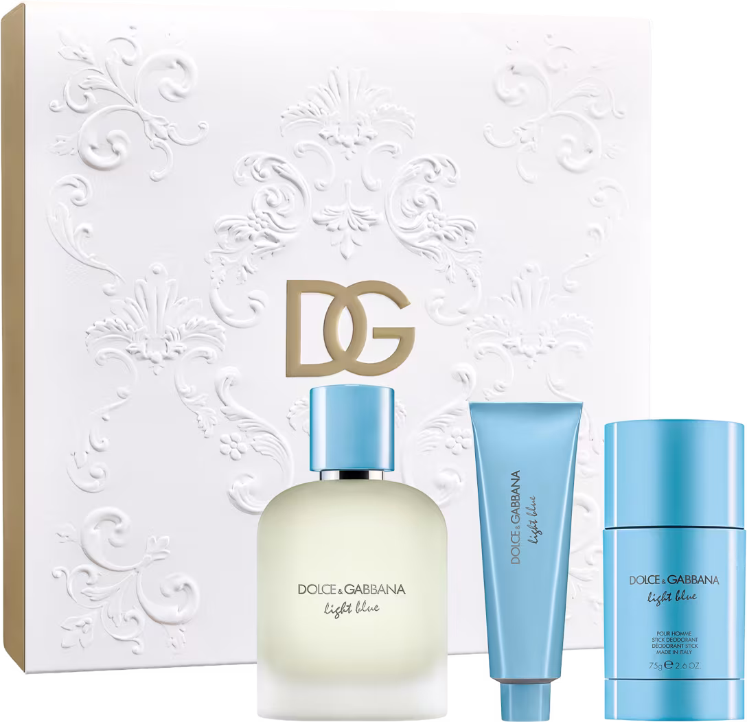 Conjunto de produtos de beleza Dolce & Gabbana Light Blue, incluindo um frasco de perfume, um tubo de shower gel e um desodorante, em uma caixa branca com detalhes florais em relevo.