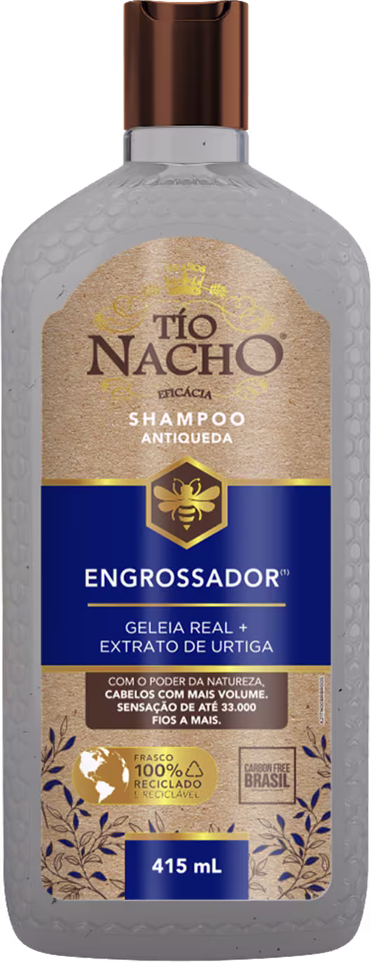 Frasco de shampoo Tío Nacho Engrossador, com 415 mL de volume, apresentando design com textura de favo de mel e rótulo em azul e dourado, destacando a presença de geleia real e extrato de urtigas.