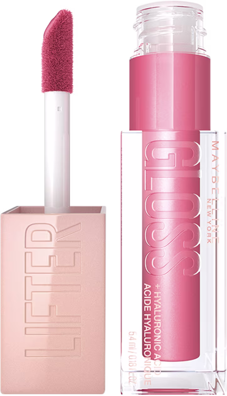 Produto de maquiagem da marca Maybelline, com embalagem em tons de rosa e branco. Trata-se de um gloss com acabamento brilhoso e textura cremosa, apresentado em um aplicador com ponta macia.