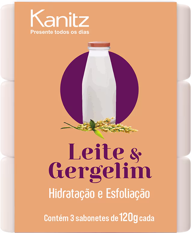 Caixa de sabonetes Kanitz com rótulo laranja e roxo, contendo 3 sabonetes de 120g cada, com imagem de um frasco de leite e gergelim, destacando hidratação e esfoliação.