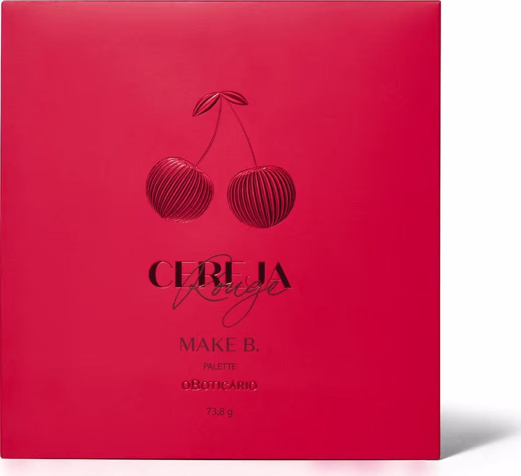 A imagem mostra uma paleta de maquiagem  "Make B.". A embalagem é uma caixa retangular de cor vermelha intensa. No centro, há uma ilustração de duas cerejas estilizadas em tons de vermelho escuro.