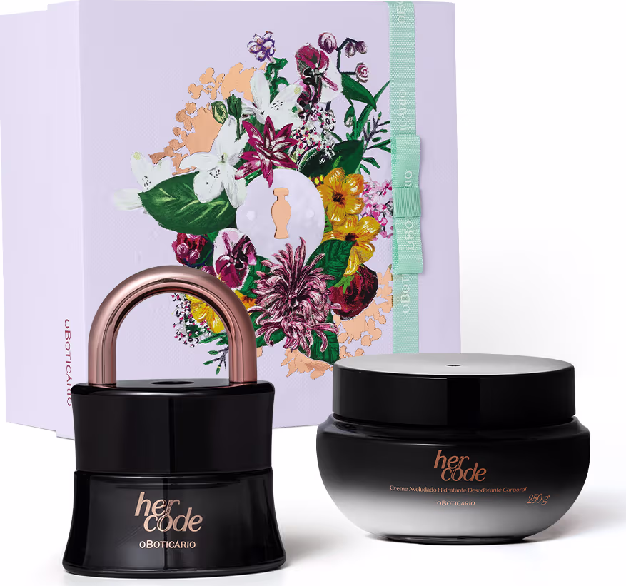 Caixa decorada com flores coloridas contendo dois produtos da marca Her Code: um frasco preto com tampa dourada e um pote preto com rótulo dourado, ambos com embalagens elegantes e sofisticadas.
