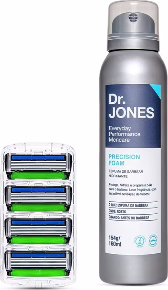 A imagem mostra um frasco contendo espuma de barbear, na cor cinza metálico com detalhes azuis e turquesas. Ao lado tem uma embalagem plástica transparente contendo quatro cartuchos de lâminas de barbear, com as lâminas em azul e verde.