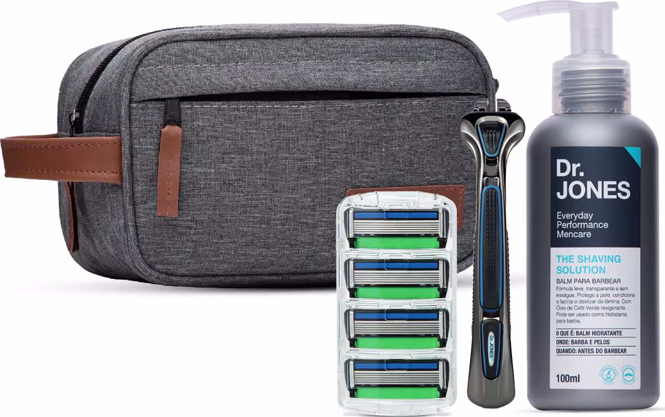 O conjunto inclui um estojo de viagem cinza, um barbeador, cartuchos de lâminas de barbear e um frasco de 100ml da Solução de Barbear da Dr. Jones, com design moderno e minimalista.