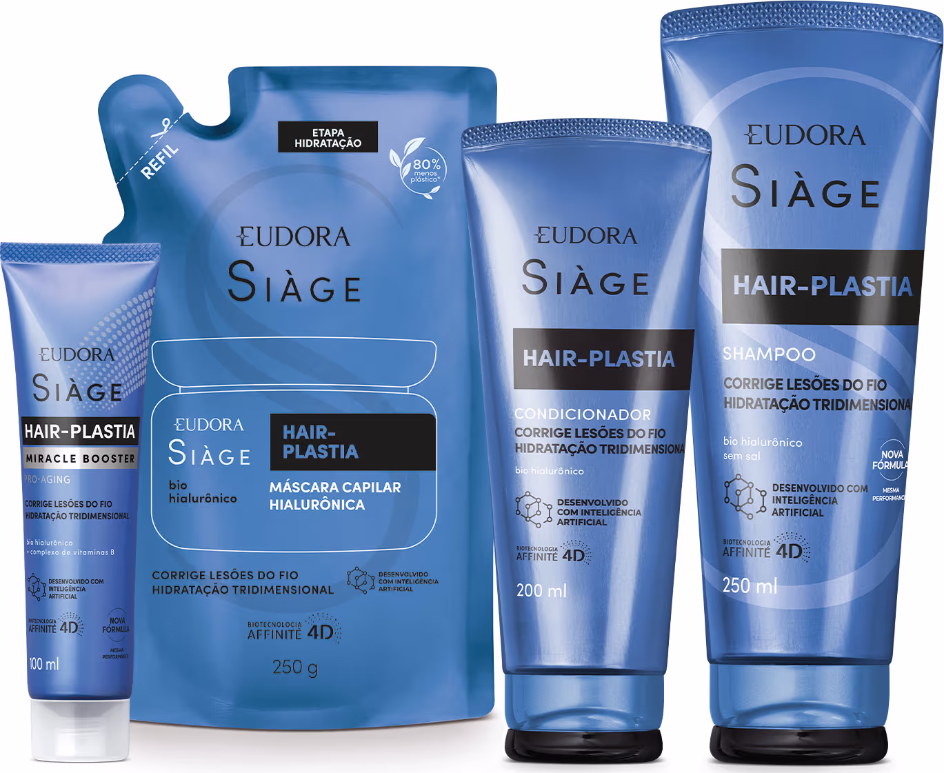 A imagem mostra um kit com quatro produtos, uma bisnaga pequena de tratamento capilar, um refil de máscara capilar, uma bisnaga de condicionador e outra de shampoo. Todos com embalagem azul, letras brancas e pretas no rótulo.